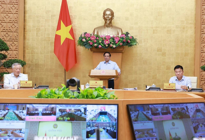 Le Premier ministre Pham Minh Chinh s'exprime lors de la visioconférence avec 34 localités. Photo: VNA thu-tuong-1.jpg