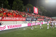 La joie de l'équipe vietnamienne à Singapour. Photo : VNA