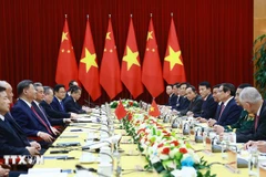 La rencontre entre le Premier ministre Pham Minh Chinh et le secrétaire général du Parti communiste chinois Xi Jinping, le 14 avril 2025 . Photo : VNA