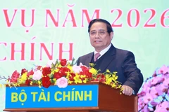 Le Premier ministre Pham Minh Chinh prend la parole lors de la conférence. Photo : VNA