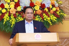 Le Premier ministre Phạm Minh Chính travaille à Hanoï avec le Conseil consultatif de politiques. Photo : VNA