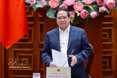 Le Premier ministre Pham Minh Chinh préside une séance de travail entre la Permanence du gouvernement et les dirigeants de Hanoï afin de donner des avis sur le Plan directeur global de la capitale Hanoï avec une vision à 100 ans. Photo : VNA