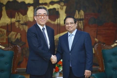 Le Premier ministre Pham Minh Chinh (droite) et le ministre sud-coréen des Affaires étrangères, Cho Tae-yul. Photo : VNA
