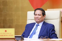 Le Premier ministre Phạm Minh Chính préside une réunion du gouvernement sur l'état de la décentralisation, de la répartition de pouvoir et de compétences liées au modèle d’organisation administrative à deux niveaux. Photo : VNA