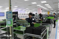 Des ouvriers de Samsung Electronics Vietnam Co., Ltd., dans le parc industriel de Yen Phong, province de Bac Ninh. Photo : VNA