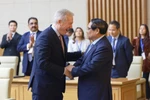 Le Premier ministre Pham Minh Chinh (droite) et le PDG du Conseil des affaires États-Unis-ASEAN, Ted Osius. Photo : VNA