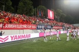 La joie de l'équipe vietnamienne à Singapour. Photo : VNA