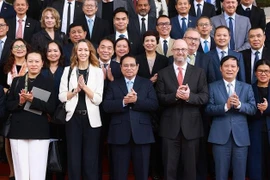 Le Premier ministre Pham Minh Chinh a présidé samedi matin 1er mars à Hanoï un échange de vue avec des entreprises américaines. Photo : VNA