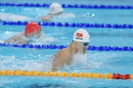 Pham Thanh Bao remporte l’épreuve du 100 m brasse, offrant la deuxième médaille d’or de la natation vietnamienne et la 14ᵉ médaille d’or de la délégation. Photo : VNA