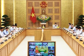 Le Premier ministre Pham Minh Chinh préside la 15ᵉ réunion du Comité national de lutte contre la pêche illégale, non déclarée et non réglementée (INN), tenue en ligne le 30 septembre. Photo : VNA