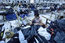 Production de produits du textile-habillement destinés à l'exportation. Photo: VNA