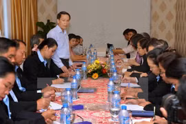 Echange professionnel entre journalistes vietnamiens et laotiens