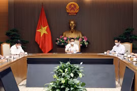 Le vice-PM Vu Duc Dam rencontre des entreprises soutenant le Fonds de vaccination contre le COVID-19