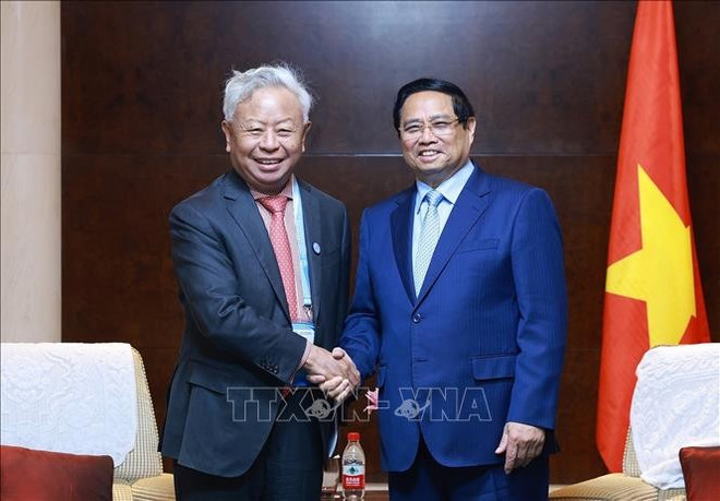 Lors de la rencontre avec le président de l’AIIB, Jin Liqun. Photo : VNA 1-3592.jpg