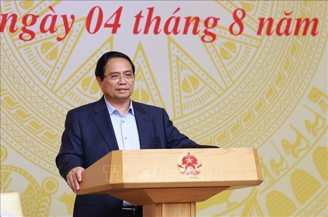 Le Premier ministre Pham Minh Chinh, président du comité national de pilotage pour la mise en œuvre de la Résolution n° 68-NQ/TW du Bureau politique sur le développement de l'économie privée. Phôt : VNA 2-2413.jpg
