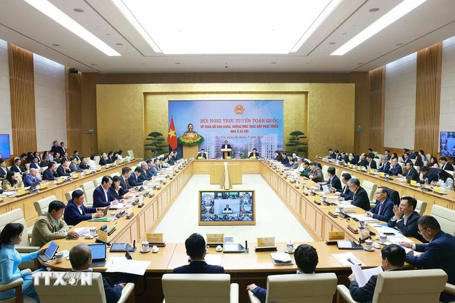 La Conférence nationale sur le règlement des difficultés et des obstacles et la promotion du développement de logements sociaux. Photo : VNA conference.jpg