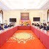 Des délégués participent au Programme de coopération et d’échanges sur l’industrie verte Vietnam-Chine. Photo: VNA