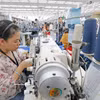 Les exportations de vêtements contribuent de manière significative aux exportations nationales. Photo : VNA