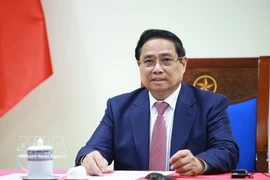 Le Premier ministre s’entretient par téléphone avec le président angolais, João Manuel Gonçalves Lourenço. Photo: VNA