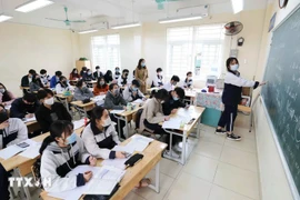 Avec 440 voix favorables sur 441 députés votants, l’Assemblée nationale a adopté la Résolution relative à l’exonération et au soutien des frais de scolarité pour les enfants d’âge préscolaire, les élèves de l’enseignement général et les apprenants suivant des programmes d’enseignement général dans les établissements du système éducatif national. Photo: VNA