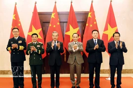 Les ministres des Affaires étrangères, de la Défense et de la Sécurité publique du Vietnam et de la Chine lors de la premier réunion du Dialogue stratégique « 3+3 ». Photo : VNA