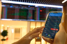 Le Vietnam consolide sa place sur la carte financière mondiale après le relèvement du classement de son marché boursier. Photo: VNA