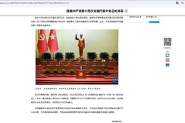 L’agence chinoise Xinhua couvre la séance d’ouverture du 14ᵉ Congrès national du Parti communiste du Vietnam. Photo: VNA