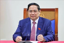 Le Premier ministre vietnamien Pham Minh Chinh s'entretient par téléphone avec Alexeï Likhatchev, directeur général de Rosatom. Photo: VNA