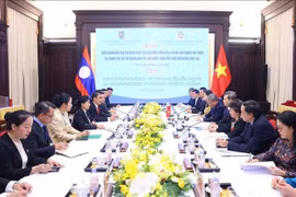 L'entretien entre le président de la Cour populaire suprême du Vietnam, Lê Minh Tri et son homologue lao, Viengthong Siphandon. Photo: VNA