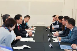 Réunion entre le ministre vietnamien de l'Industrie et du Commerce, Nguyên Hông Diên, et le ministre d'État au Cabinet du Japon, Kazuchika Iwata, à Melbourne. Photo: VNA