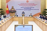 Lors d'une réunion avec le corps diplomatique accrédité au Vietnam pour rendre compte de la réorganisation du système politique, des unités administratives et de la mise en œuvre du modèle d’administration locale à deux niveaux au Vietnam. Photo : VNA