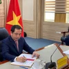 Singature en ligne de l'accord Vietnam-Singapour sur la mise en œuvre de l’article 6 de l’Accord de Paris sur le climat. Photo: VNA
