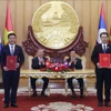 Échange du protocole d’accord entre les ministères de l’Industrie et du Commerce du VIetnam et du Laos