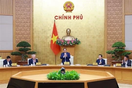 Le Premier ministre Pham Minh Chinh préside le 6 décembre la réunion gouvernementale périodique du mois de novembre 2025. Photo: VNA