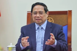 Le Premier ministre Pham Minh Chinh lors de l'entretien téléphonique. Photo: VNA