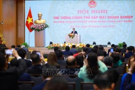 Le Premier ministre Pham Minh Chinh s'exprime lors de la conférence. Photo: VNA