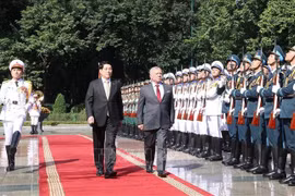 Le président du Vietnam, Luong Cuong (à gauche), et le roi de Jordanie, Abdullah II Ibn Al Hussein. Photo: VNA
