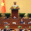 L’Assemblée nationale débat du projet de loi modifiant et complétant des dispositions de la loi sur la Banque d’État du Vietnam, de la loi sur la prévention et la lutte contre le blanchiment d’argent et de la Loi sur les établissements de crédit. Photo : VNA