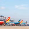 Avions des compagnies aériennes nationales à l'aéroport international de Nôi Bai, à Hanoi. Photo : NIA/qdnd.vn