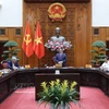 Le Premier ministre Pham Minh Chinh préside la réunion de la permanence du gouvernement sur la préparation de la mise en œuvre du projet de réserve nationale de pétrole brut à Nghi Son. Photo : VNA