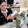 Les banques mettent en œuvre diverses solutions pour soutenir les entreprises. Photo : VNA