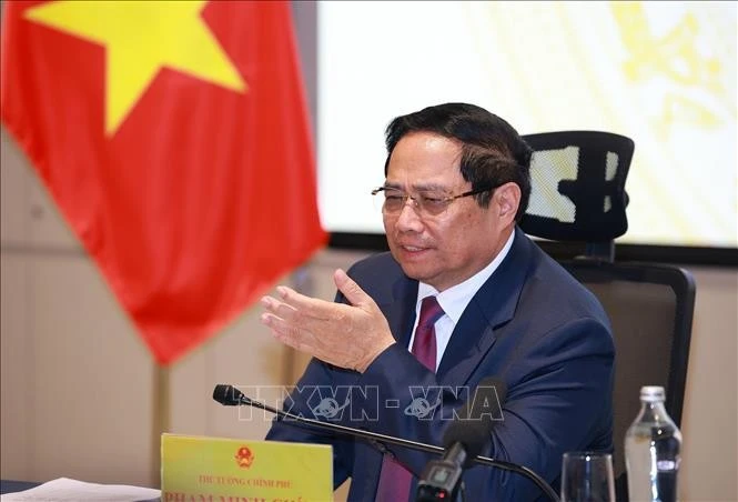 Le Premier ministre Pham Minh Chinh préside la réunion. Photo : VNA