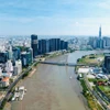 La zone urbaine d'Ho Chi Minh-Ville, située au long des deux côtés du fleuv Saigon, dans la ville de Thu Duc et le district 1, se développe de manière moderne, ouvrant de nouveaux espaces et une dynamique de croissance. Photo: www.qdnd.vn