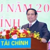 Le Premier ministre Pham Minh Chinh prend la parole lors de la conférence. Photo : VNA
