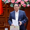 Le Premier ministre Pham Minh Chinh préside une séance de travail entre la Permanence du gouvernement et les dirigeants de Hanoï afin de donner des avis sur le Plan directeur global de la capitale Hanoï avec une vision à 100 ans. Photo : VNA