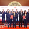 Cérémonie de signature d'accords de coopération entre entreprises vietnamiennes et chinoises. Photo : VNA