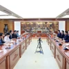 La séance de travail entre le ministre des Finances Nguyen Van Thang et l’ambassadeur de Chine au Vietnam, He Wei. Photo : VNA