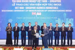 Échange du protocole d'accord de coopération entre Vietnam Airlines et Singapore Airport Terminal Services Limited (SATS). Photo: VNA