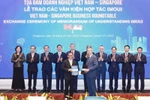 Échange du protocole d'accord de coopération entre Vietnam Airlines et Singapore Airport Terminal Services Limited (SATS). Photo: VNA