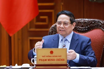 Le Premier ministre Pham Minh Chinh s'exprime lors de la réunion. Photo: VNA